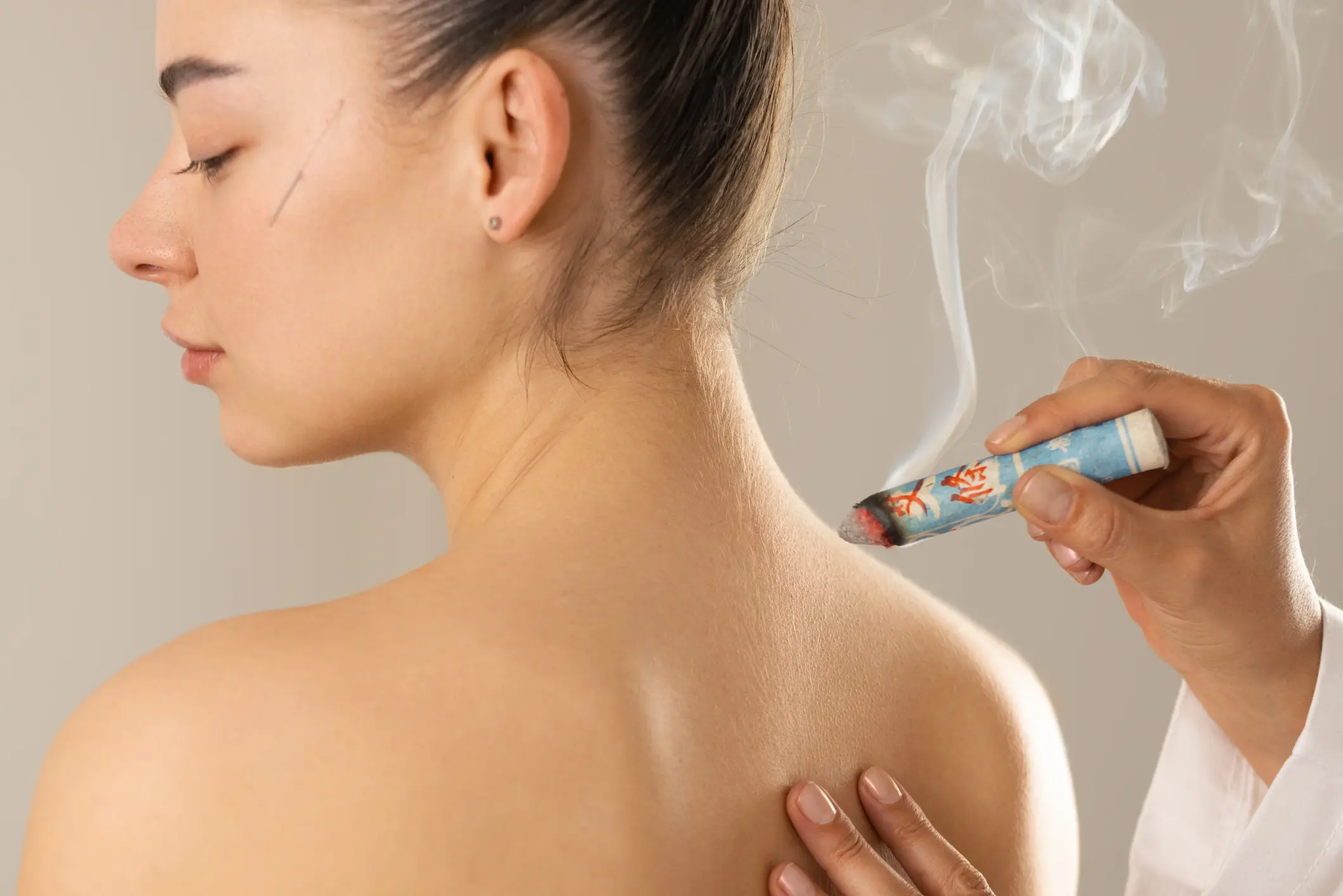 A person receiving a smoking therapy treatment on their back.
